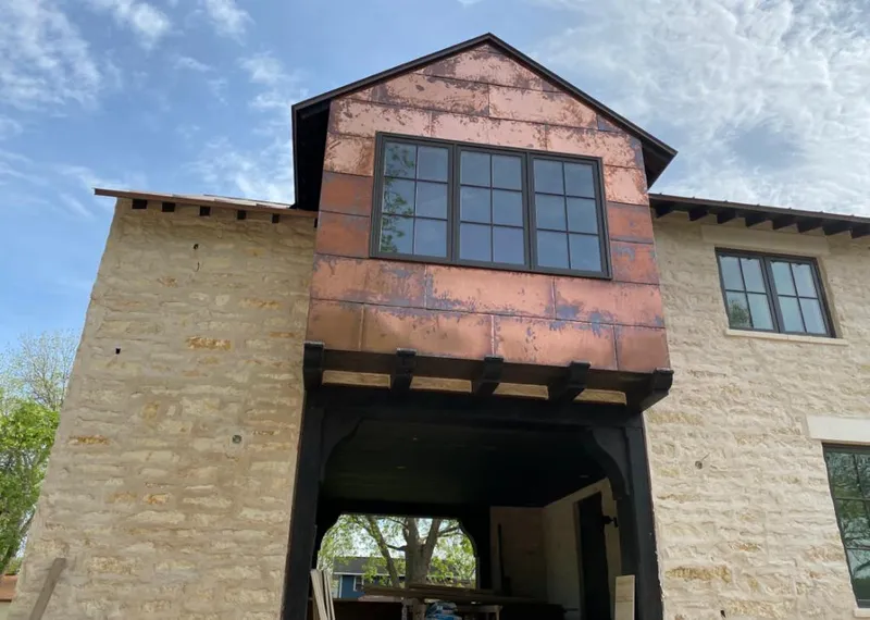 Copper metal panel facade on a stone building for Skylight Installation in Maricopa